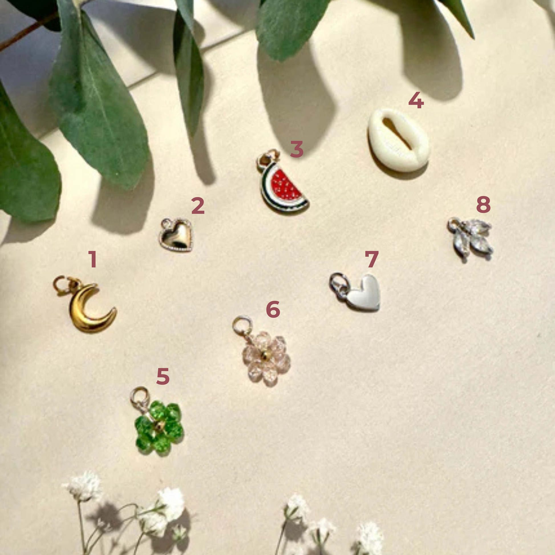 breloque lune, coeur, fleur et coquillage 